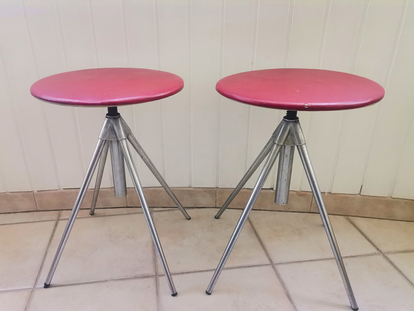 Pair of German red leather swivel stools