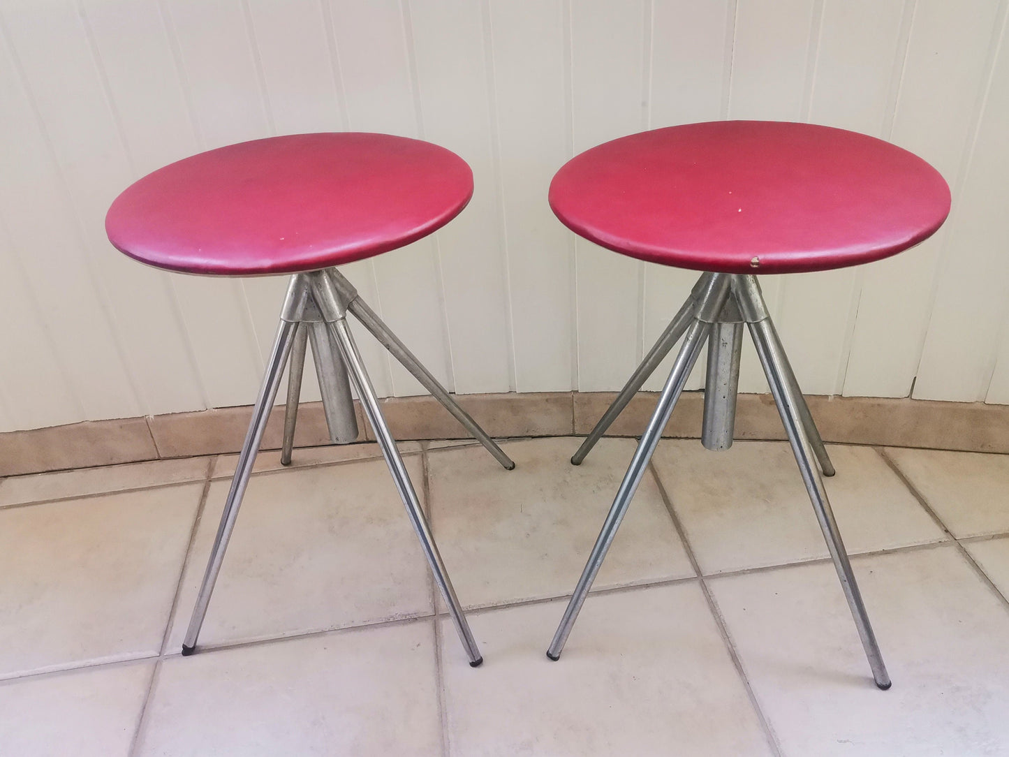 Pair of German red leather swivel stools