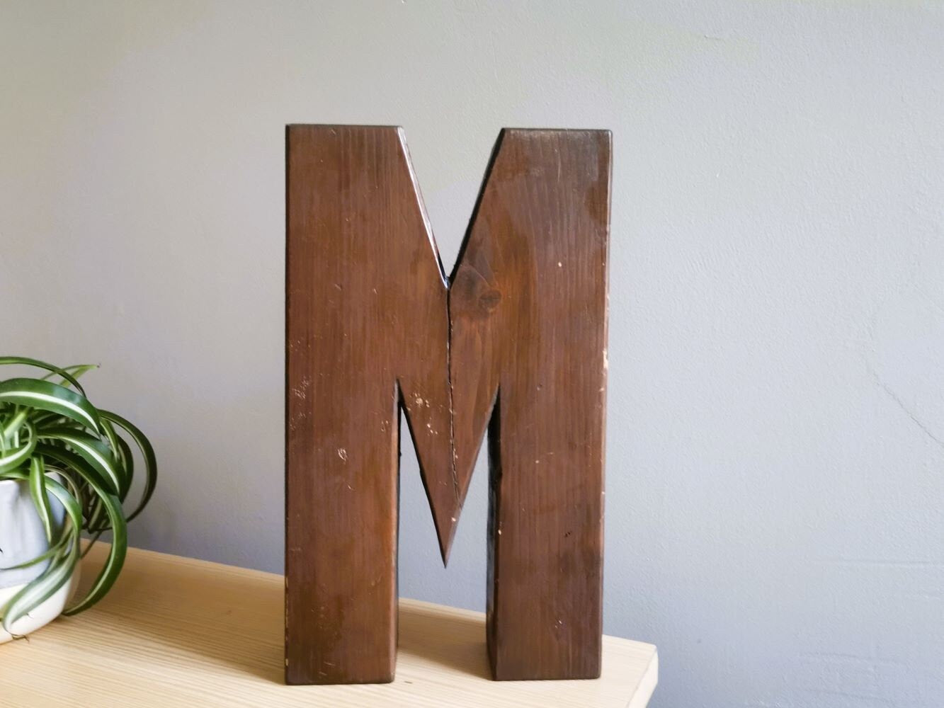 Wooden signage letter M