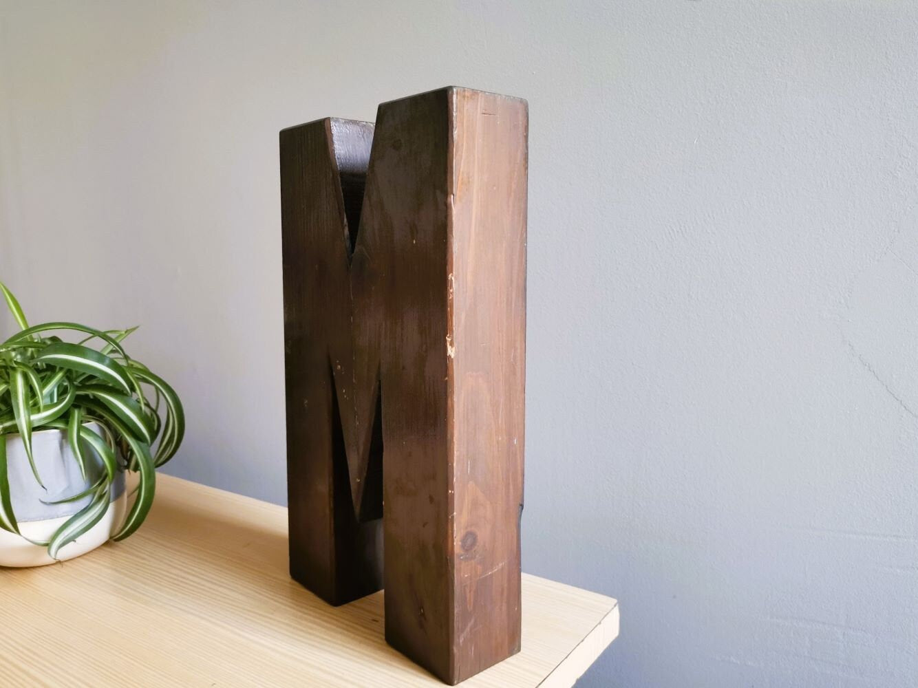 Wooden signage letter M