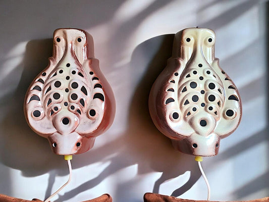 Pair plug in ceramic wall sconces