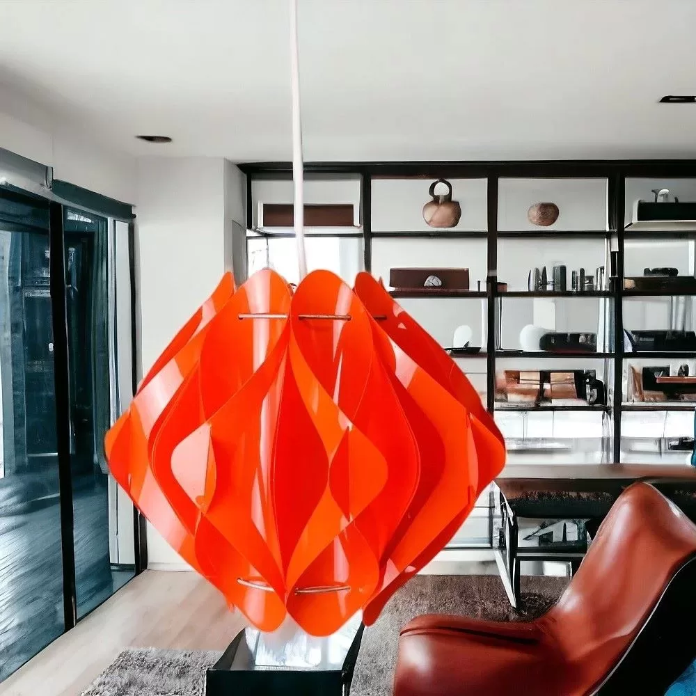 Modern orange acrylic chandelier in a living room