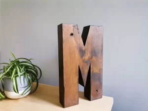 Solid wood lock letter M side view
