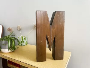 Solid wood lock letter M front view