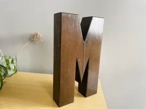 Solid wood lock letter M side view